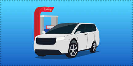 A white SUV at a fuel pump